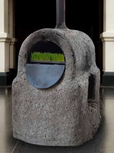 Taller Plástica Social. Instalación de horno con pasto verde en su interior, 1990.