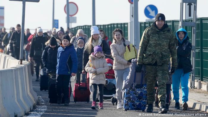 Ucranianos saliento de Kiev. Foto: Picture Aliance.