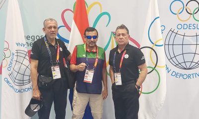 El maestro Tomás Arturo Orué (centro), sirviendo como voluntario en estos Juegos Odesur. Foto: Gentileza