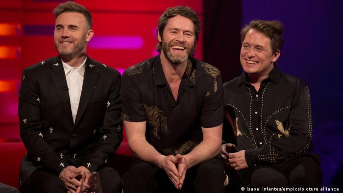 La banda británica "Take That": Gary Barlow, Howard Donald y Mark Owen (de izquierda a derecha). Foto: DW